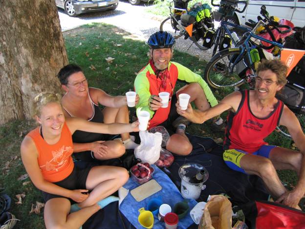 Touring cyclists toasting lunch with wine, Corona, Italy © 2012 Frosty Wooldridge