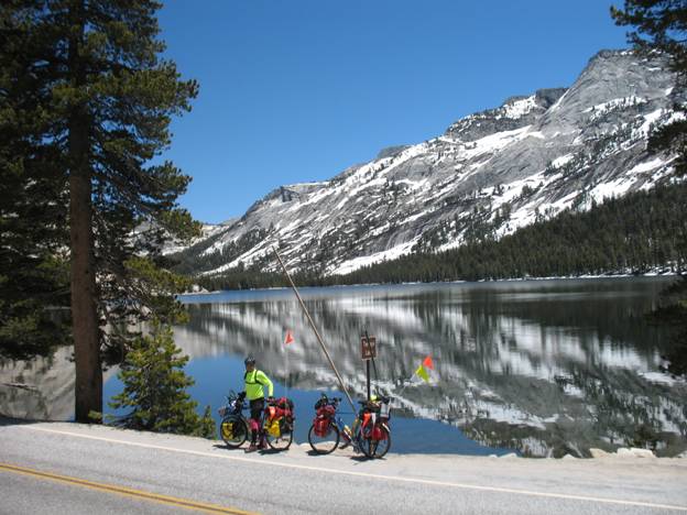 Touring cyclist stopping for lunch, Lake Tenaya, Sierra Mountains, California © 2012 Frosty Wooldridge