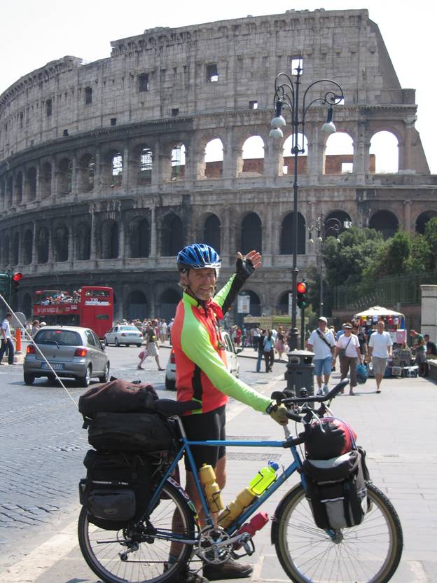 Touring cyclist standing in front of the Coliseum, Rome, Italy © 2012 Frosty Wooldridge